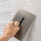 Stainless steel double-notched trowel